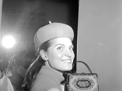 Unidentified woman trying on a beret.