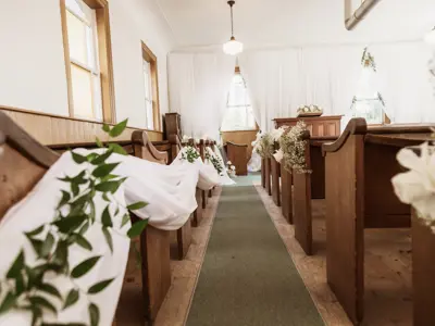 Cameron Church, interior pews with flowers.