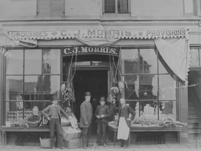 Men in bowler hats in front of C.J. Morris store, Sarnia.