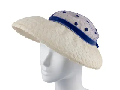Hazel Davidson: White, woven sunhat with blue polka dot netting and a blue velvet ribbon. 