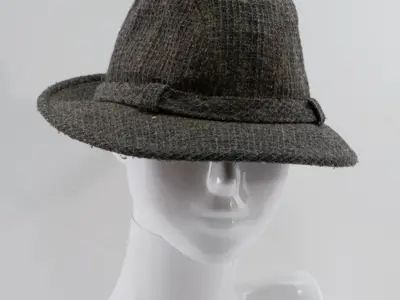 Dark grey tweed hat leaning towards the trilby style.