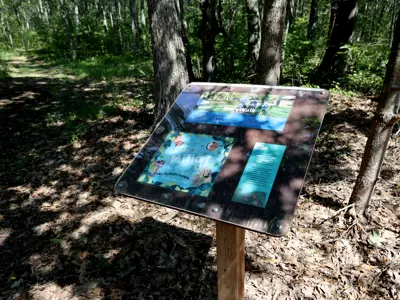 StoryWalk board at the mouth of the Woodland Heritage Trail at Lambton Heritage Museum