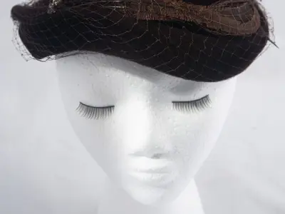 Hazel Matthews: Sculptural brown velour hat with pheasant feathers and netting. Merrimac label.