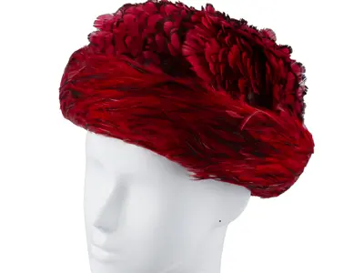 Hazel Matthews: Henri original red hat covered in two types of feathers. 